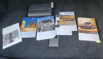 Owner's manuals and warranty information for a 2010 Mercedes-Benz E-Class E350 in the trunk.