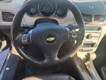 Interior view of a 2009 Chevrolet Malibu LTZ showing leather seats and dashboard features
