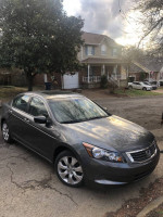 2008 Honda Accord sedan in excellent condition, parked on a residential street with trees and houses nearby.