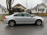 2009 Volvo S80 T6 AWD in silver with leather interior parked on a residential street