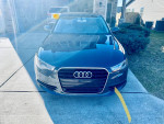 Front view of a 2012 Audi A6 Premium Plus for sale, showing its sleek design and parked in a driveway.