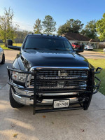 Front view of a black 2018 Ram 3500 Big Horn truck with steel bumpers and Texas license plate.