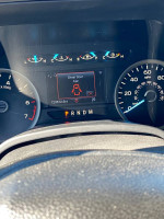 Dashboard display of a 2018 Ford F150 XLT showing mileage and alerts in great condition.