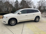 2013 Buick Enclave Leather Group in white, parked outdoors with alloy wheels and tinted windows.