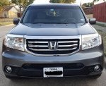Front view of a 2012 Honda Pilot EX FWD SUV with 89,000 miles, showcasing its sleek design and chrome grille.