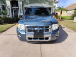 Front view of a 2011 Ford Escape Limited with leather interior and tinted windows for sale.
