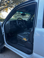 Interior view of a 2006 Chevrolet Silverado 1500 showing the driver's seat and dashboard.