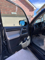 Interior view of a 2008 Toyota Land Cruiser showing door entry and dashboard details.