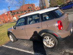 2012 MINI Cooper Countryman parked, featuring manual transmission and stylish design. Well maintained with good mileage.