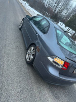 2007 Saab 9.3 with turbo, minor rust, and heated seats parked on a snowy road.