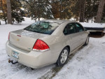 2012 Chevrolet Impala LT parked in snowy landscape, showcasing excellent condition and recent maintenance.
