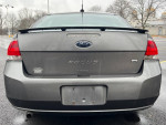 Rear view of a 2011 Ford Focus SE sedan in gray color with clean exterior, no accidents.