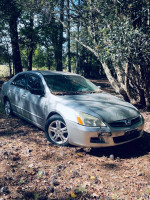 2007 Honda Accord SE sedan for sale, silver color with 51,000 miles, requires repairs, parked in a wooded area.