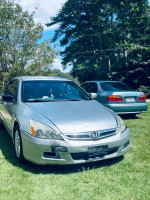 2007 Honda Accord SE for sale, silver color, parked on grass, needs repair, with new battery and ceramic brakes.