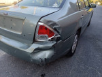 2009 Ford Fusion in good condition with minor rear damage, suitable for commuting or rideshare services.