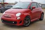 2015 FIAT 500 Abarth in red with original rims, front view showcasing its sporty design and manual transmission.