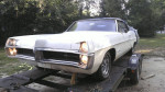 1967 Pontiac Catalina Convertible parked on trailer, showcasing its pristine body and vintage appeal.