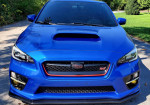 Front view of a 2017 Subaru WRX STI Limited in World Rally Blue with a sporty design