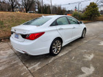 2011 Hyundai Sonata in white with 57,000 miles, showcasing the sporty design and features.