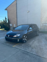 Black Volkswagen Jetta GTI parked, featuring alloy wheels and clean design, ready for sale with original mileage.