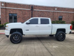 2018 Chevrolet Silverado 1500 Z71 LT 4WD in white with custom wheels, high lift, and 133,000 miles.
