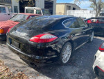 2010 Porsche Panamera S in black, showcasing a sleek design, offered at auction with low mileage and clean title.
