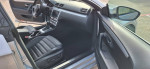 Interior view of a 2013 Volkswagen CC Sport with black leather seats and modern dashboard features.