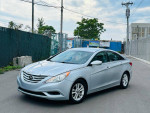 2011 Hyundai Sonata GLS in silver color with low mileage, parked on the street, highlighting its clean exterior.