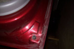 Close-up of the red paint detail on a 2001 Chevrolet Suburban with no rust