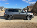 2019 Nissan Armada SL in silver, featuring V8 engine, leather seats, and new tires parked in driveway