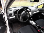 Interior view of a 2015 Subaru Impreza showcasing the dashboard and front seats.