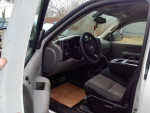 Interior view of a 2008 Chevrolet Silverado 1500 Work Truck with clean seats and dashboard.