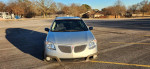 2006 Pontiac Vibe in silver color, parked, showing front view, reliable commuter vehicle with new tires.