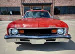 1973 Chevrolet Nova Custom Sedan in red, showcasing its classic design and vintage appeal, available for cash or trade.