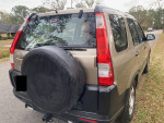 2006 Honda CR-V LX FWD parked, featuring new battery and clean exterior, perfect for commuters and families.