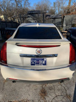 Rear view of a Cadillac CTS with a custom bumper, showing clean exterior and tinted windows.