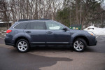2013 Subaru Outback in gray color parked in a snowy area, showcasing its all-wheel drive capability.
