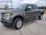 2017 Ford F250 Platinum truck in gray color with clean title and low mileage, showcased outdoors.