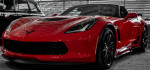 2015 Chevrolet Corvette Z06 in vibrant red, showcasing sleek design and luxury features.