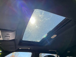 Sunroof view of a 2009 Land Rover Range Rover Supercharged SUV interior with sleek black design.