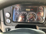 Dashboard of a 2013 Freightliner Cascadia showing mileage and RPM gauges, well-maintained condition.