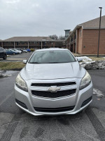 Front view of a 2013 Chevrolet Malibu Eco FWD in good condition, lightly used with 66,000 miles.
