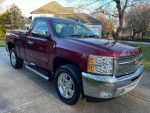 2013 Chevrolet Silverado 1500 in Deep Ruby color parked outside, showcasing chrome details and new tires.