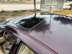 Top view of a maroon 2005 Lexus ES 330 showcasing the sunroof and clean exterior.
