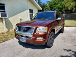 2010 Ford Explorer XLT in clean condition with 107,000 miles, parked in front of a house.