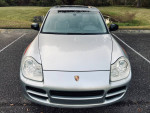 Front view of a 2005 Porsche Cayenne S AWD in Reflex Silver with low mileage and clean Carfax.