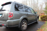 2007 Honda Pilot EX-L FWD in very good condition, parked on driveway surrounded by trees.