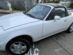 1994 Mazda Miata MX-5 with 177,000 miles, showing some cosmetic wear and a clean exterior view.