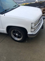 Close-up of a 1994 Chevrolet C1500, showcasing stylish wheels and pristine condition.