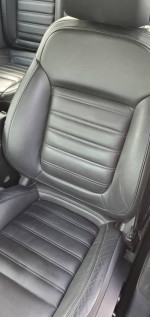 Close-up of the black leather seat in a 2013 Buick Regal GS, showcasing its premium quality and sporty design.